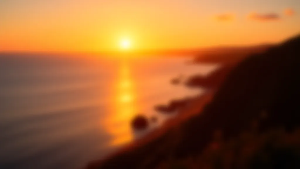 Sunset over ocean from clifftop vantage point, golden and orange hues reflecting on water, peaceful evening light